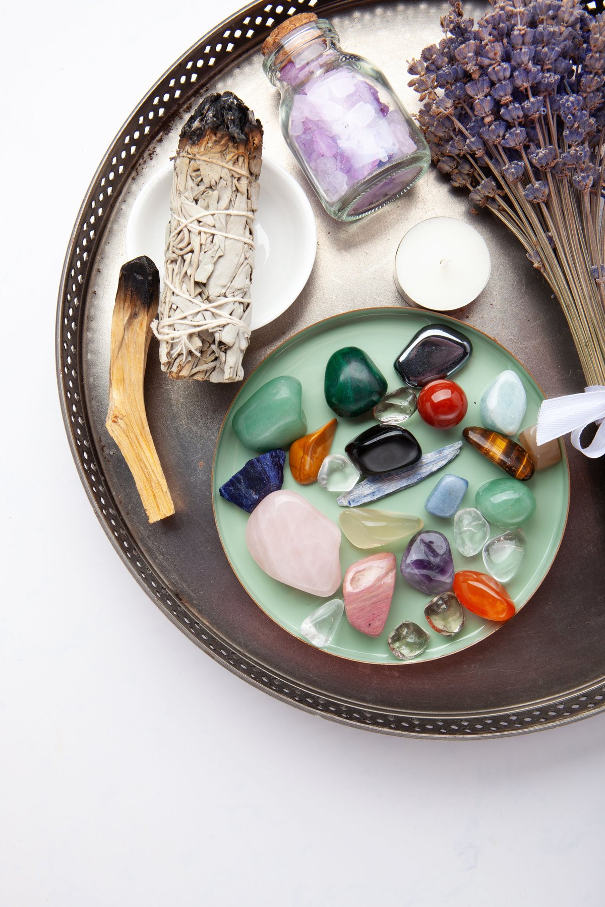 Chakra Crystal Healing Ritual With Lavender Palo Santo White Sage Essential Oils And Candles On White Marble Background